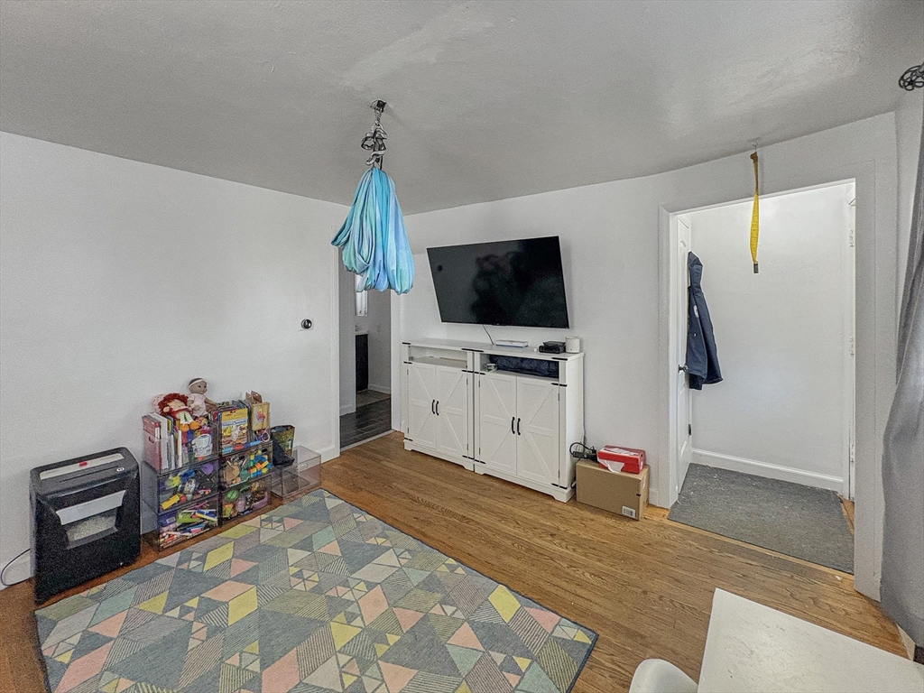 4 Cuff Avenue Springfield, MA 01104 - Photo 11 of 24 a bedroom with a bed and a flat screen tv