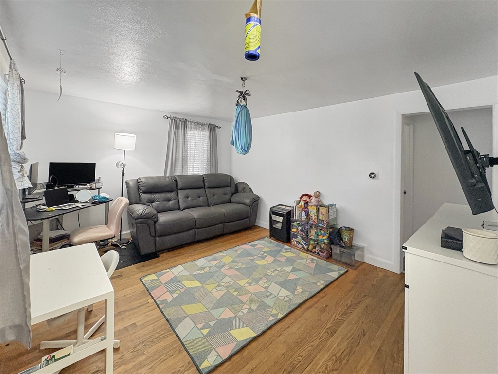 4 Cuff Avenue Springfield, MA 01104 - Photo 10 of 24 a living room with furniture and a flat screen tv