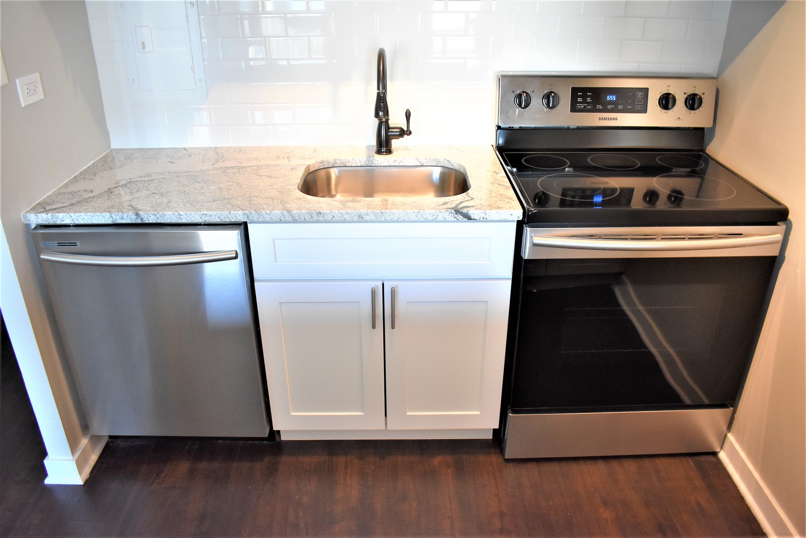 6166 North Sheridan Road, Unit 10D Chicago, IL 60660 - Photo 4 of 23 a kitchen with a sink and a microwave
