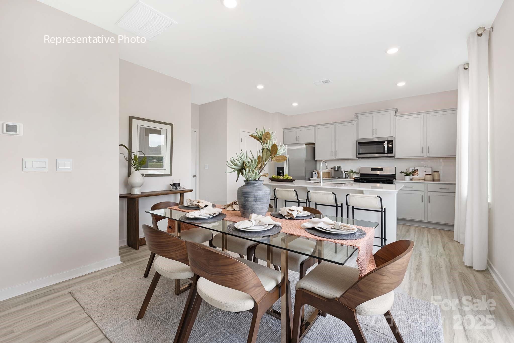 2683 Goose Fair Road Maiden, NC 28650 - Photo 9 of 22 a dining room with kitchen island furniture a dining table and chairs