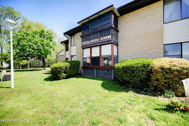 a view of a porch and garden