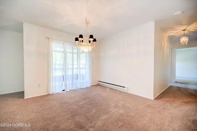 a view of a room with a flat screen tv