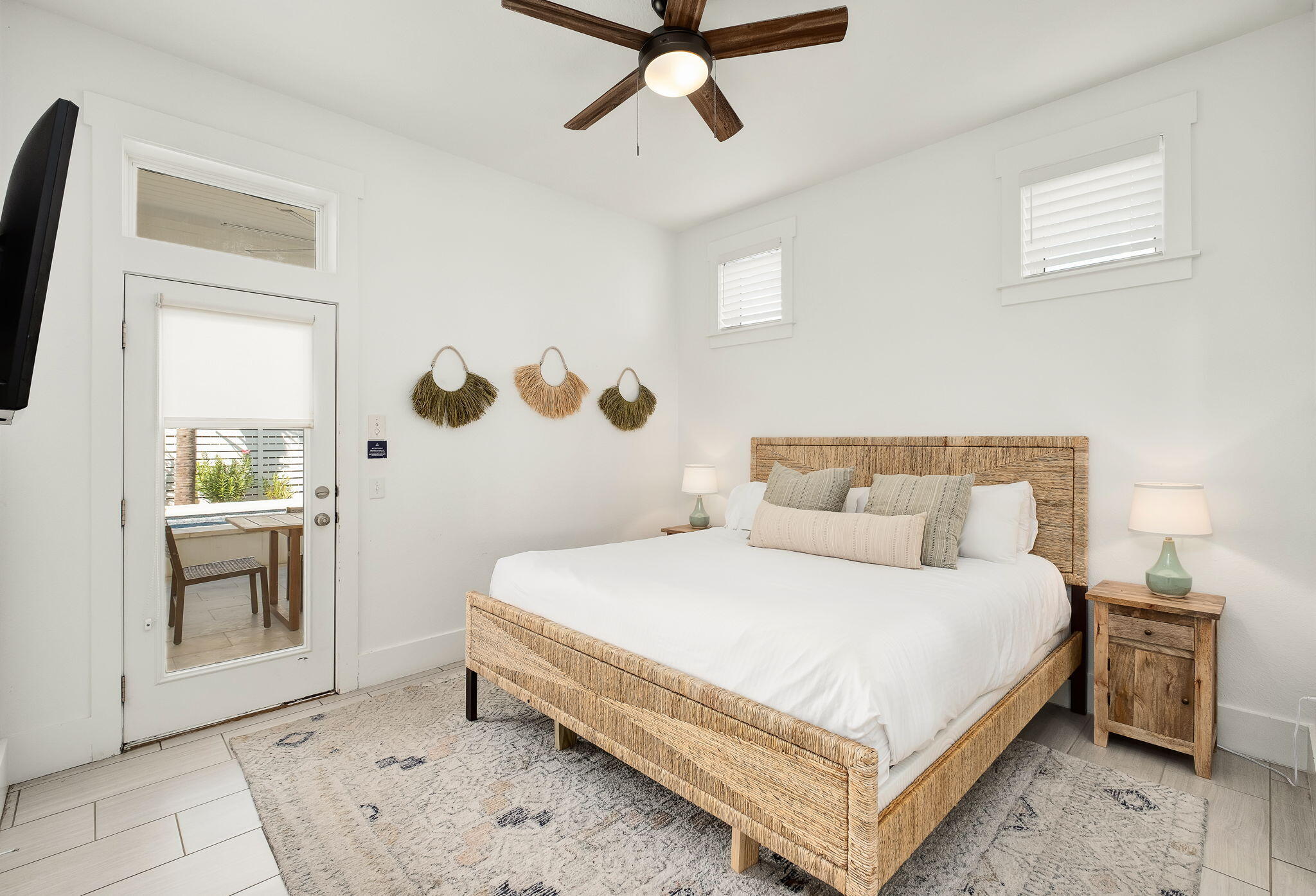3319 East County Highway 30A Santa Rosa Beach, FL 32459 - Photo 19 of 44 a bedroom with a bed and a chandelier