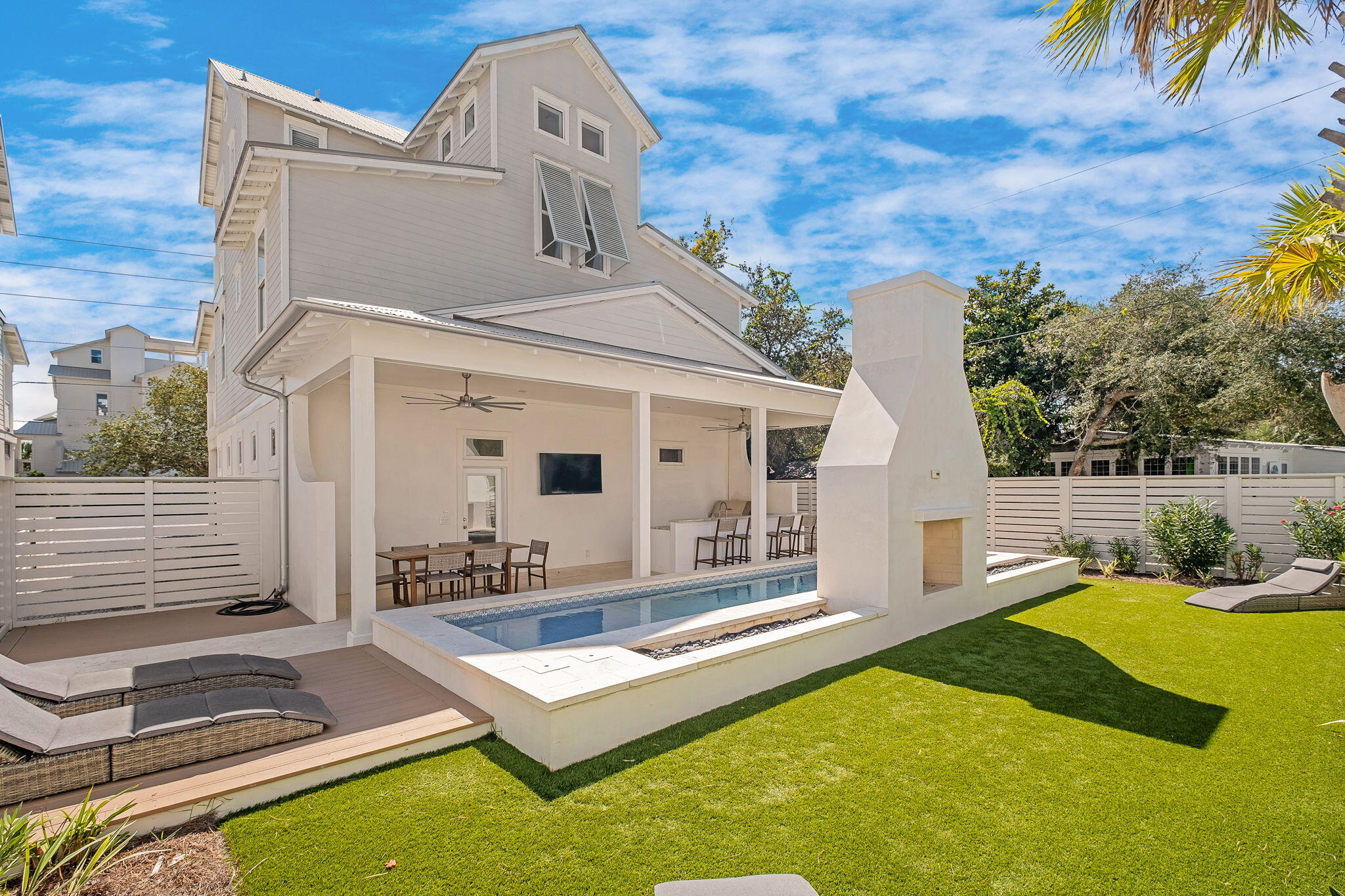 3319 East County Highway 30A Santa Rosa Beach, FL 32459 - Photo 2 of 44 a view of a house with pool and chairs