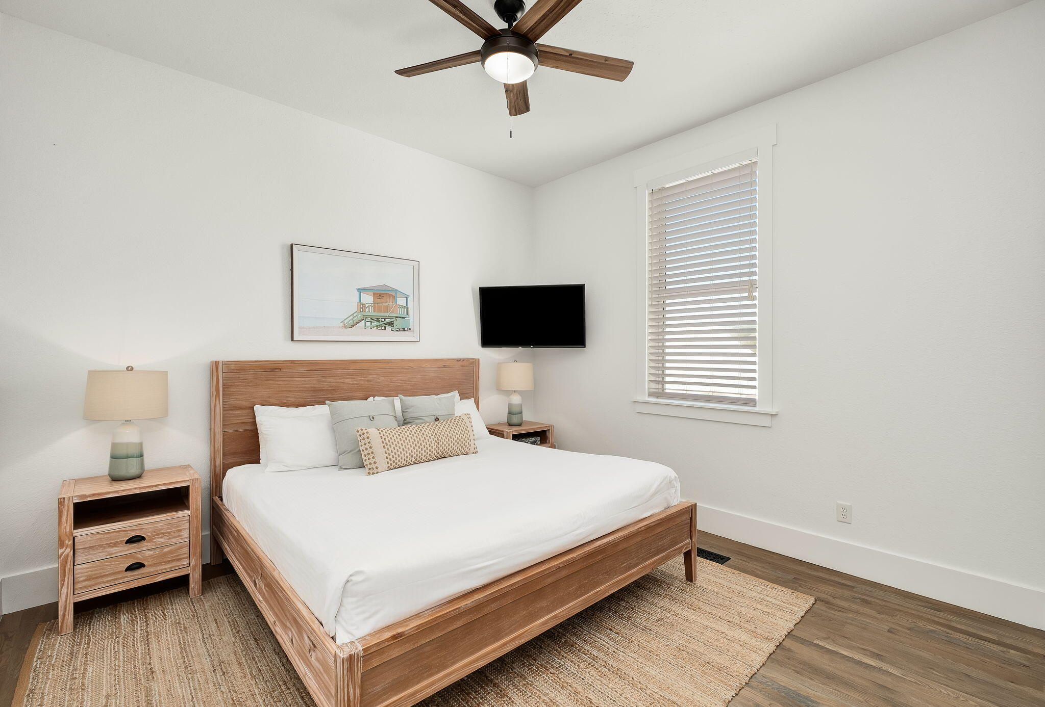 3319 East County Highway 30A Santa Rosa Beach, FL 32459 - Photo 25 of 44 a bedroom with a bed and a flat screen tv