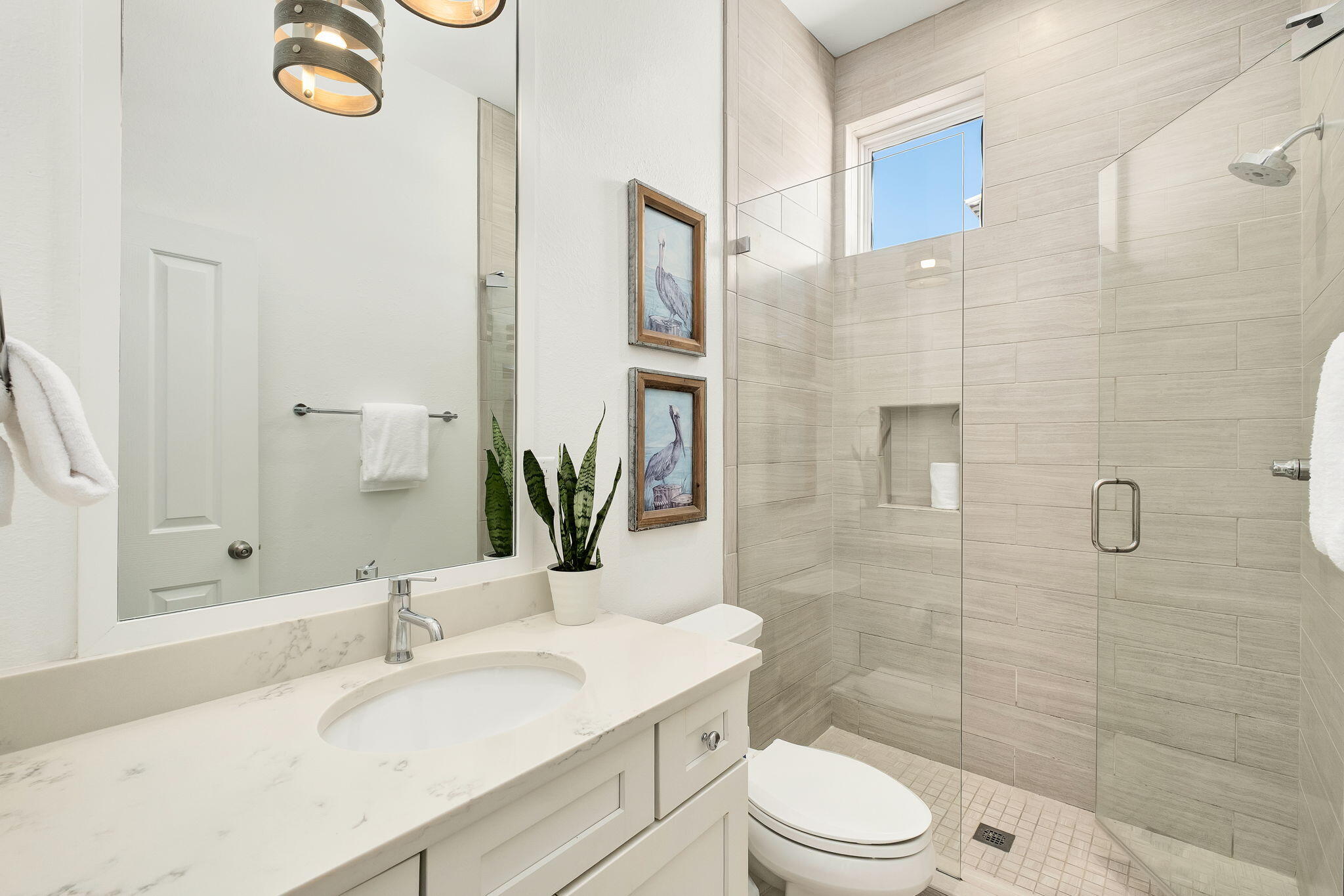 3319 East County Highway 30A Santa Rosa Beach, FL 32459 - Photo 26 of 44 a bathroom with a granite countertop sink toilet a mirror a vanity and shower