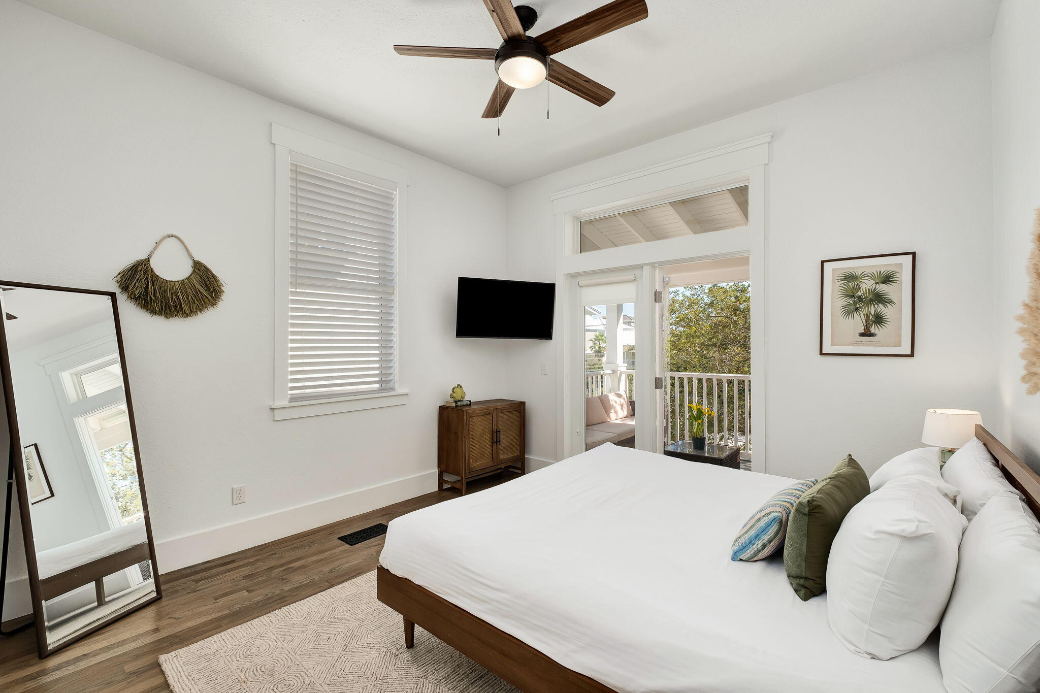 3319 East County Highway 30A Santa Rosa Beach, FL 32459 - Photo 28 of 44 a bedroom with a bed a window and a flat screen tv
