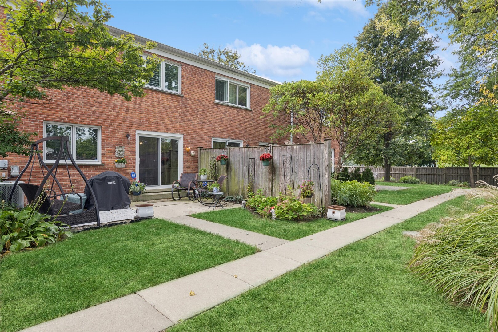494 Old Surrey Road Hinsdale, IL 60521 - Photo 16 of 21 a view of a house with backyard sitting area and garden