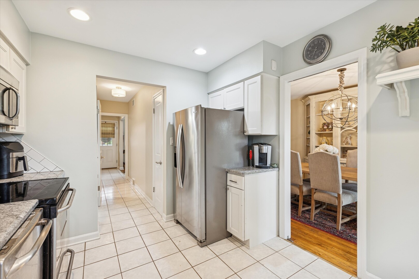 494 Old Surrey Road Hinsdale, IL 60521 - Photo 7 of 21 a kitchen with stainless steel appliances a refrigerator and a stove top oven