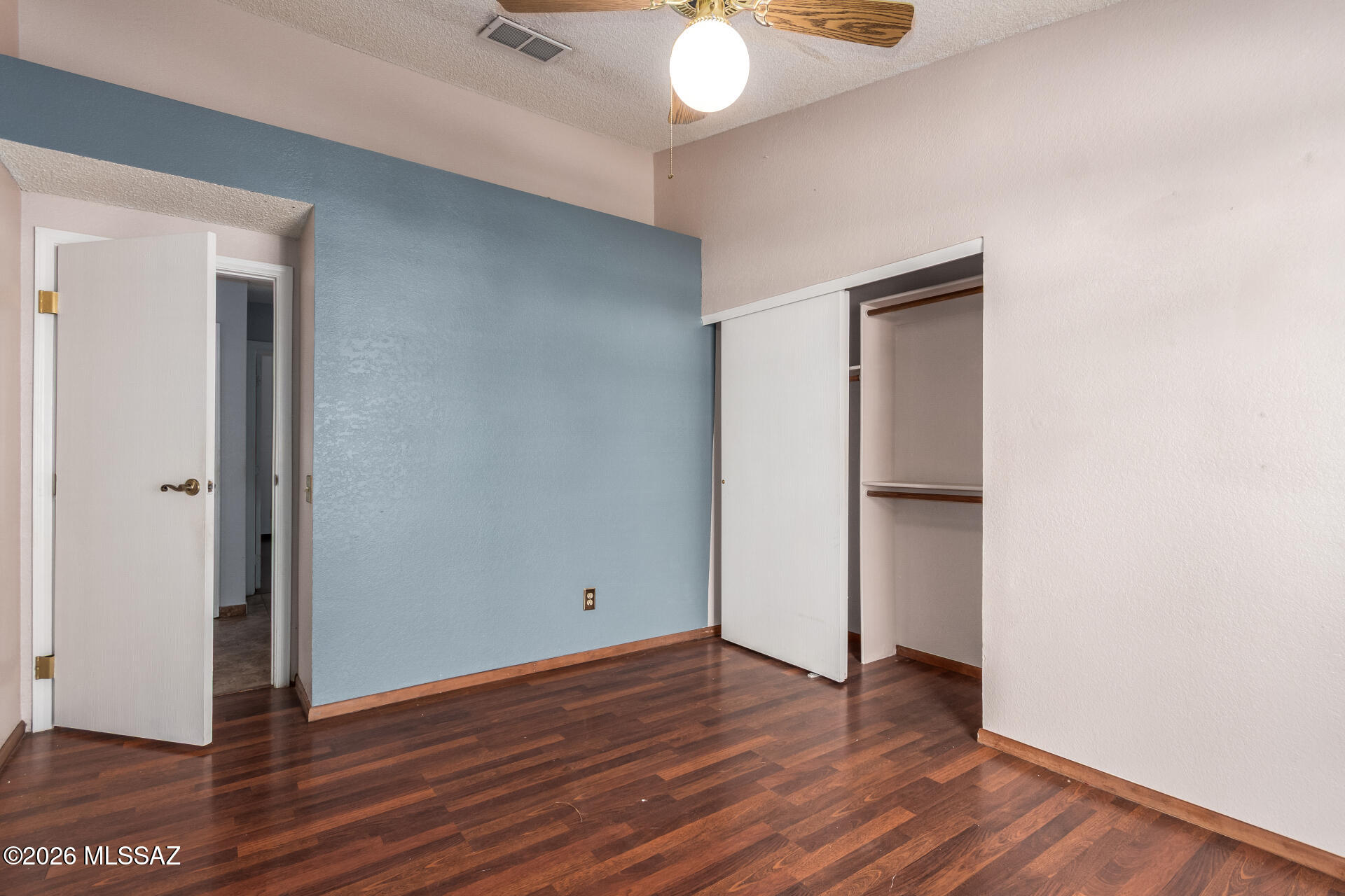 5331 West Eaglestone Loop Tucson, AZ 85742 - Photo 26 of 35 a view of an empty room with wooden floor