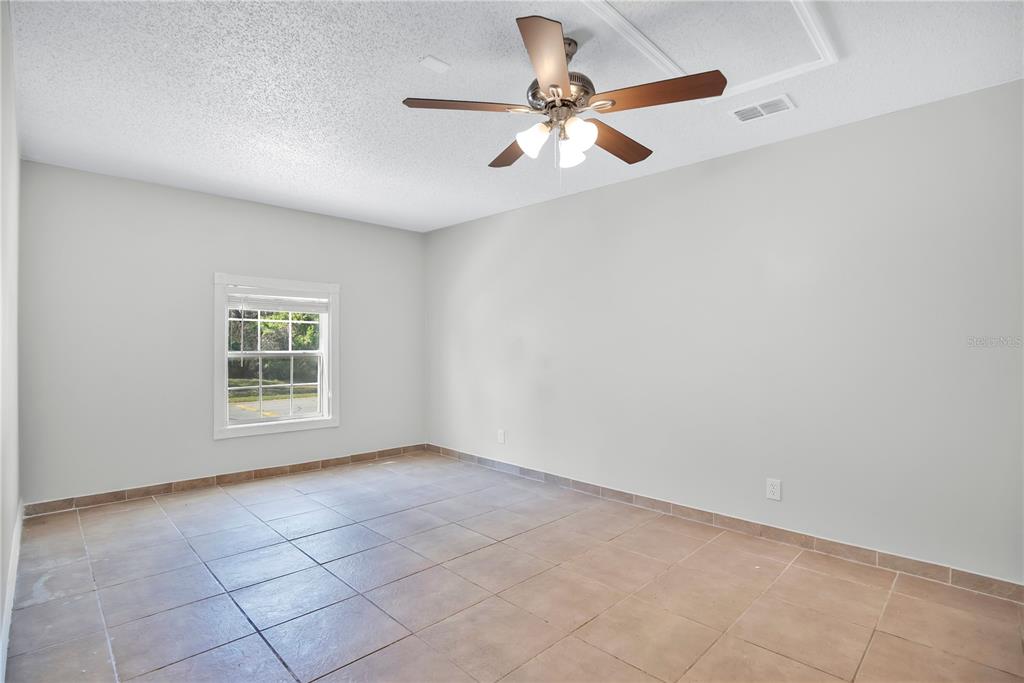 1537 Rivers Edge Drive Orlando, FL 32825 - Photo 14 of 30 an empty room with a window and a fan