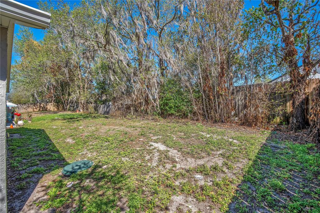 1537 Rivers Edge Drive Orlando, FL 32825 - Photo 26 of 30 a view of outdoor space with deck and yard