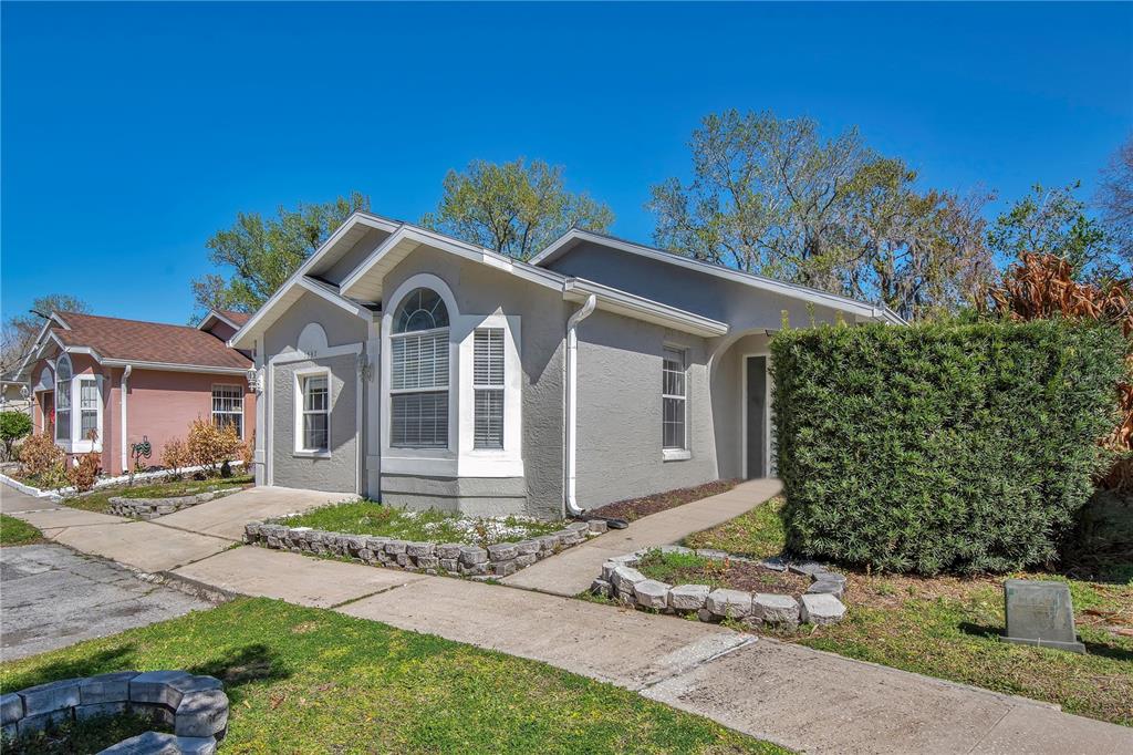1537 Rivers Edge Drive Orlando, FL 32825 - Photo 3 of 30 a front view of a house with garden