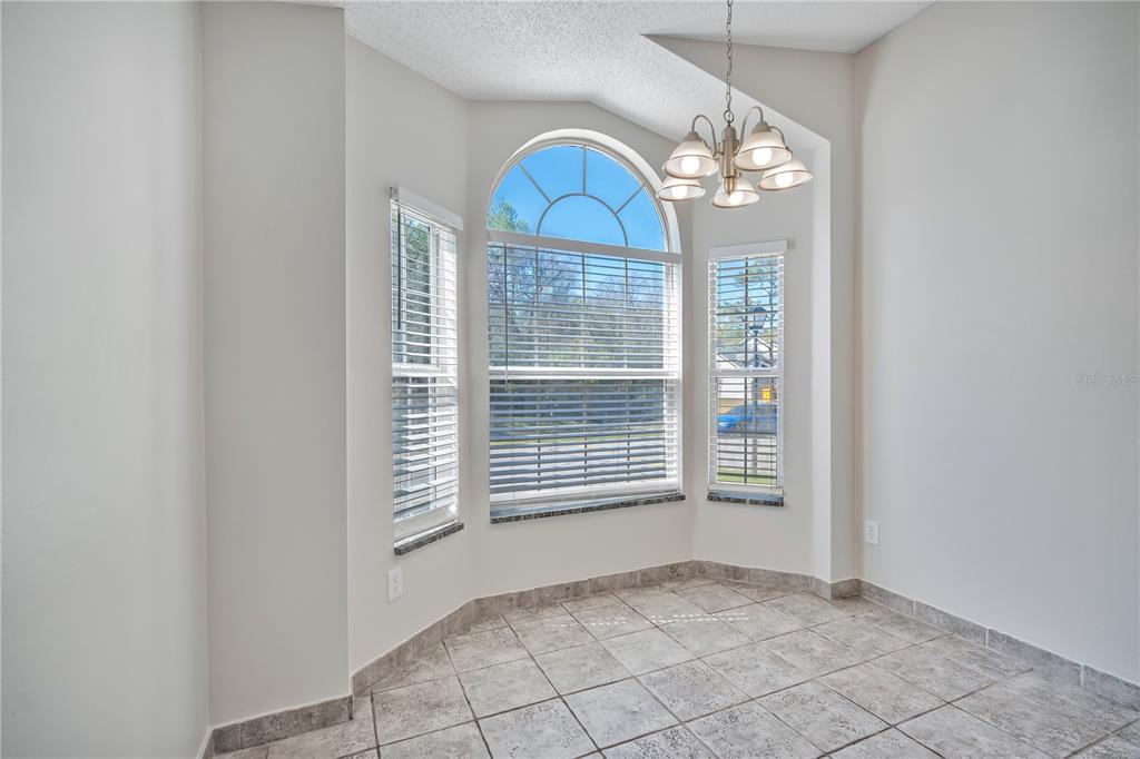1537 Rivers Edge Drive Orlando, FL 32825 - Photo 10 of 30 a view of a room with windows and chandelier