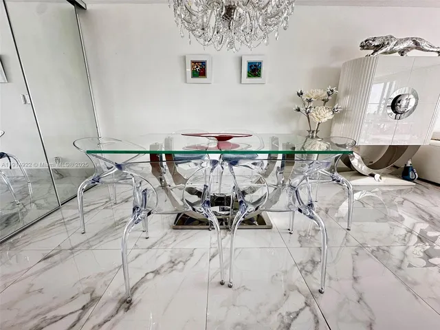 a view of a patio with table and chairs