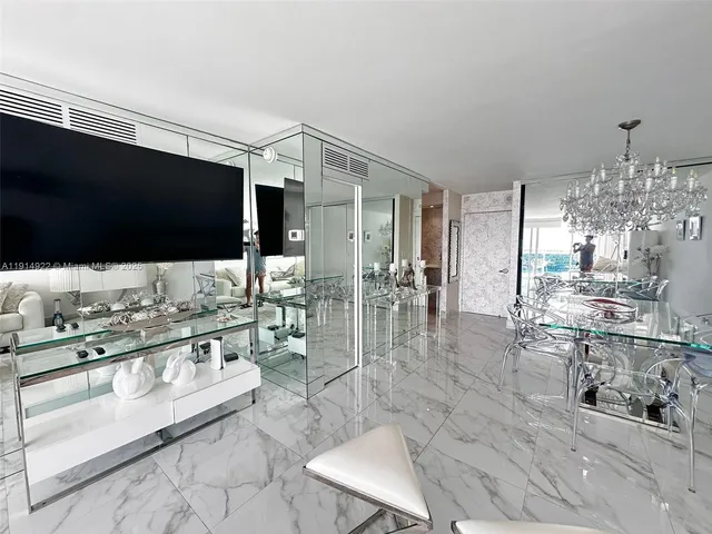 a lobby with furniture and flat screen tv