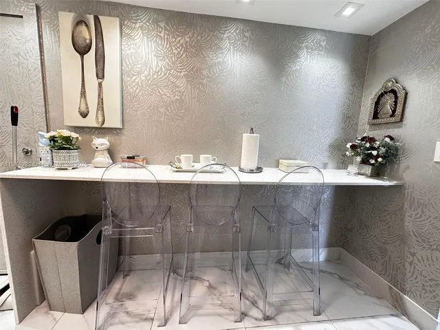 a view of balcony with furniture and wooden floor