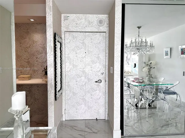 a bathroom with a mirror and a shower