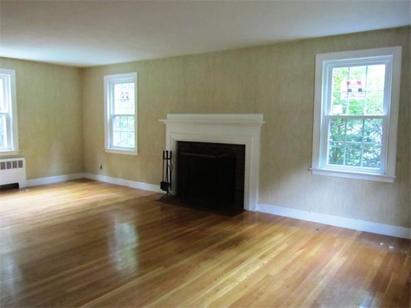 18 Constitution Road Lexington, MA 02421 - Photo 3 of 11 a view of an empty room with wooden floor and a window