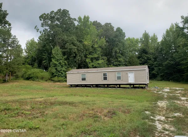 a white house with a large pool