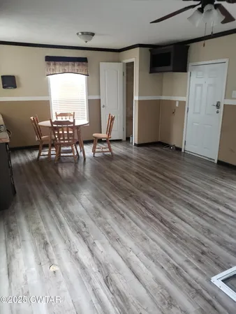 a view of a livingroom with furniture and wooden floor