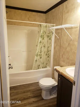 a bathroom with a toilet and shower