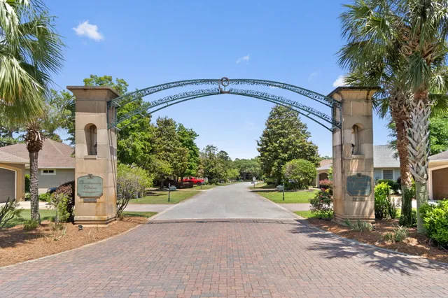 a view of a pathway both side of house