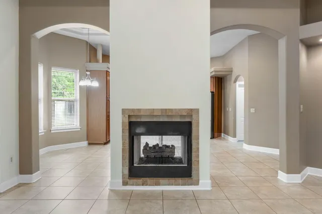 a kitchen with stainless steel appliances granite countertop a refrigerator oven a sink dishwasher and a stove with kitchen island