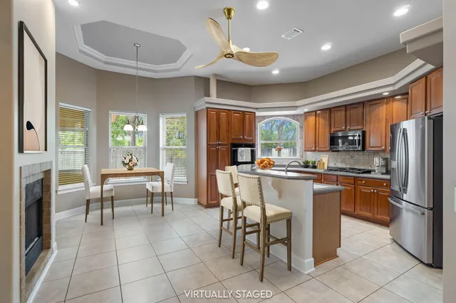 a view of an empty room with a fireplace and a window