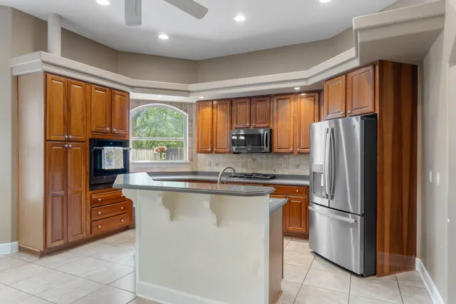 a kitchen with a sink and a window