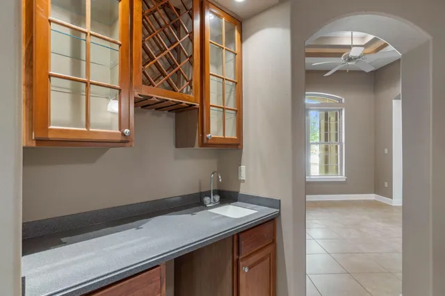 a view of a hallway with closet and mirror