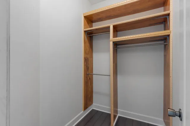 a bathroom with a double vanity sink mirror and shower