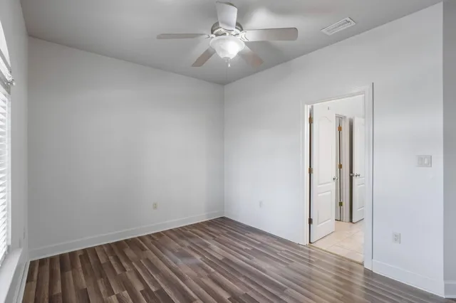 a bathroom with a sink vanity granite shower and a mirror