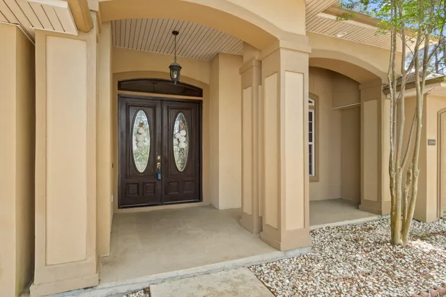 a front view of a house with parking space