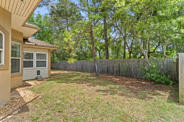 a view of a city & street with a building in the background