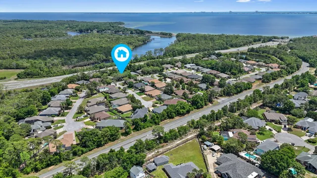 a view of a hallway with entryway wooden floor and dining room view