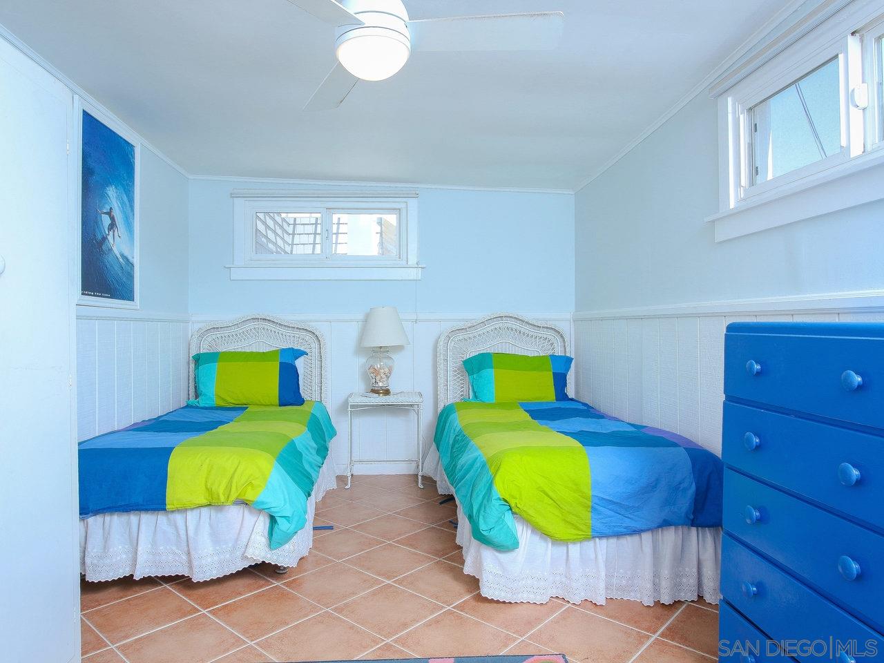 2212 Ocean Front Del Mar, CA 92014 - Photo 13 of 17 a room with two beds and painting on the wall