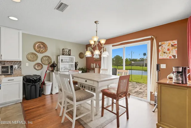 a kitchen with refrigerator and cabinets