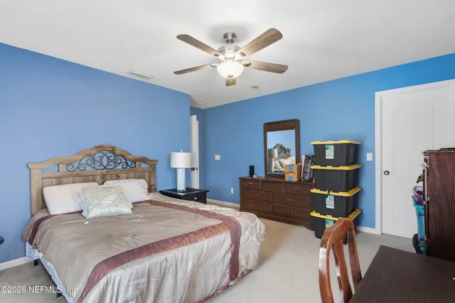 a bedroom with a bed furniture and a window