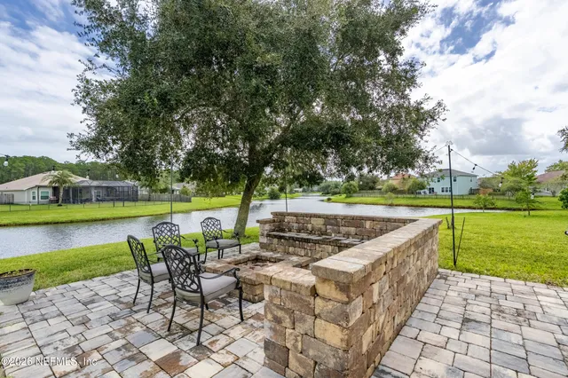a view of a golf course with a lake view