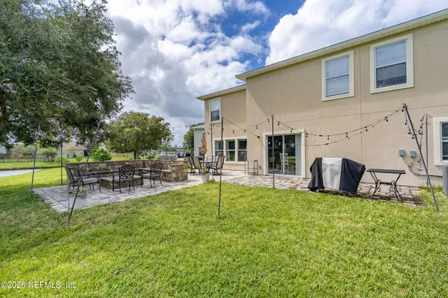 a view of a chairs and table in the patio