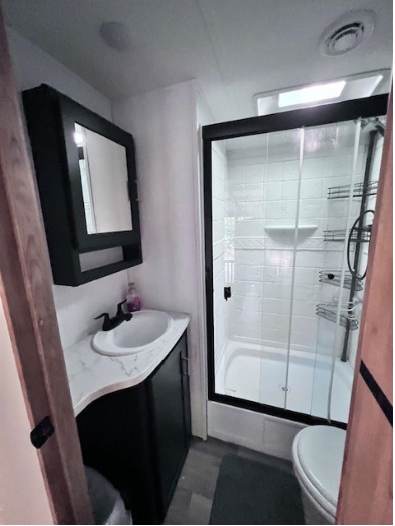 669 9th Cape May, NJ 08204 - Photo 12 of 20 a bathroom with a sink and a mirror