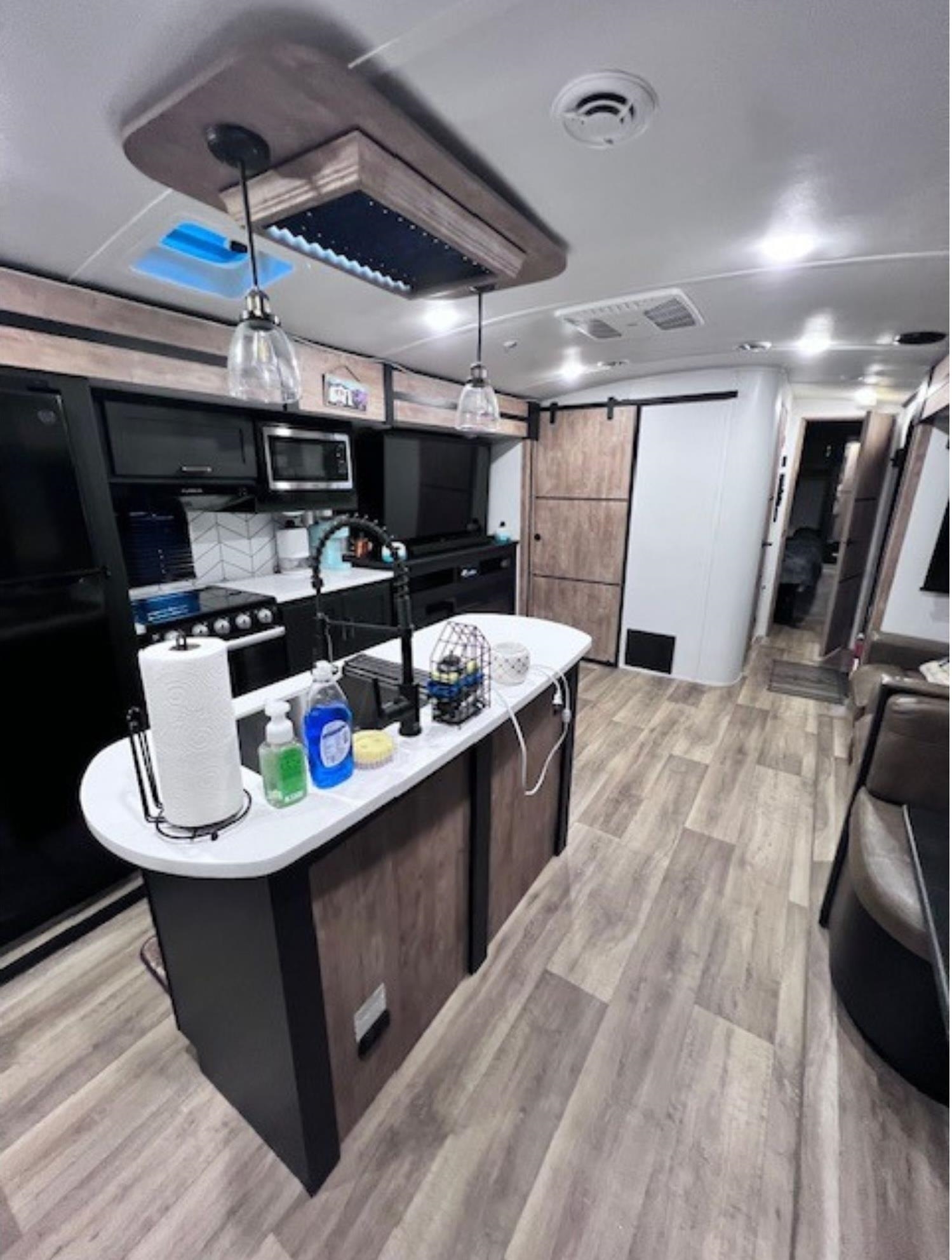 669 9th Cape May, NJ 08204 - Photo 7 of 20 a kitchen with stainless steel appliances kitchen island granite countertop a sink dishwasher stove and cabinets