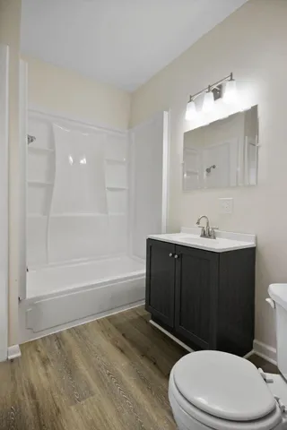 a bathroom with a sink a toilet and bathtub