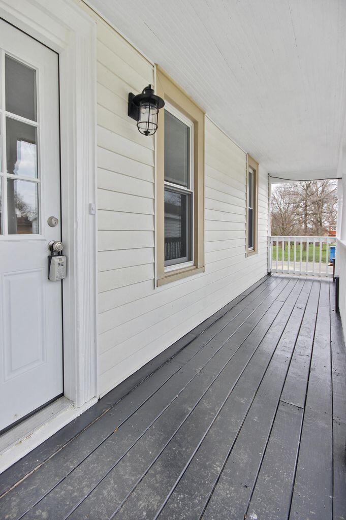 10450 West 93rd Avenue St. John, IN 46373 - Photo 13 of 22 wooden floor in an empty room with a window