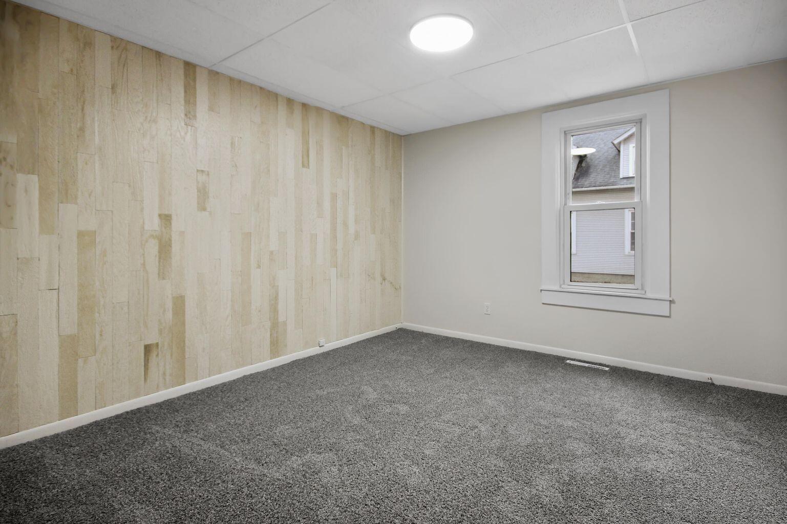 10450 West 93rd Avenue St. John, IN 46373 - Photo 7 of 22 a view of an empty room with a window