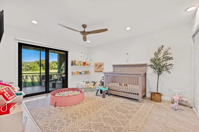 a room with furniture and a baby crib