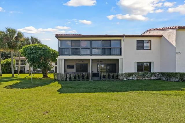 a view of a swimming pool with an outdoor space and seating area
