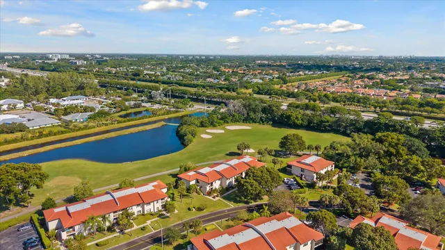 an aerial view of a houses with a swimming pool