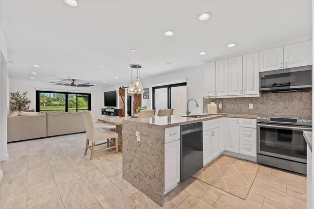 a dining room with furniture and window